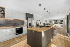  7 Callantina Court Frankston VIC 3199 $930,000 - $1,020,000 Exquisitely renovated, yet never too far from its inspired architectural origins, this 4-bedroom, 2-lounge family home showcases a timeless design with a bold modern twist, relishing a peaceful bowl-of-court setting the growing family will surely love. Crafted for comfort and connection across a well-zoned allotment, every inch has been reimagined to keep pace with real family living without sacrificing any style. It's all polish and presence from the street with its enhanced facade, stepping inside to fresh timber-look floors, a wood flue heater and cathedral ceilings over its split-level lounge and formal dining room. A wall of north-facing windows illuminates the captivating kitchen in unison with LED feature lighting, adorning the quality appliances and wood-look counters of its island-style entertainer's design. The rear family and dining space slides outdoors to a covered terrace that's party-ready, stretching out to a low-maintenance yard and separate firepit zone with space for the kids, and still plenty left over for a trampoline or pool (STCA). The master's walk-through robe and show-stopping ensuite match classic with contemporary, while the main bathroom mirrors the same high-end finish for the remaining three bedrooms that surround. Comfort is locked in with ducted heating, split-system air conditioning, LED lighting, solar power, a storage shed and a double garage, with its position set in one of the area's most liveable pockets, metres from Kingsley Park Primary, and just moments from Shaxton Reserve, buzzing cafés, buses, natural walking trails, and easy access to Frankston CBD, Karingal Hub, and the Mornington Peninsula. 