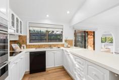  32 Wyoming Rd Wyoming NSW 2250 Single-Level Beauty with Space and Sunshine Instantly appealing from the moment you arrive, this immaculate brick and tile residence is framed by established trees and landscaped gardens, setting the tone for the warmth and style that continues throughout. Beautifully upgraded and thoughtfully re-crafted, this stunning single-level home offers a picture-perfect lifestyle in a sought-after location. Step inside to discover a smart and functional floor plan with multiple living zones, seamless indoor-outdoor flow, and stylish updates throughout. The heart of the home is the sunlit kitchen with an inbuilt breakfast bar, which overlooks the north-facing patio—a private and sunny space perfect for entertaining or simply relaxing with your morning coffee. The generously sized backyard offers the potential to add a deck or swimming pool (STCA), with plenty of space for kids and pets to play. Features include: – Four spacious bedrooms, all with built-in wardrobes. – Large master bedroom with walk-in robe and private ensuite. – Two well-proportioned bathrooms, with the potential to add value over time. – Fresh new carpet in all bedrooms and new vinyl flooring throughout living areas. – High ceilings in the kitchen and dining rooms, enhancing natural light and space. – Ducted air conditioning for year-round comfort. – Stylish, functional kitchen with ample cabinetry and breakfast bar. – Multiple living areas for flexible family living. – North-facing patio/suntrap, perfect for entertaining. – Single lock-up garage with drive-through access to the backyard. – Additional off-street parking for two vehicles. – Ample internal storage throughout the home. – Low-maintenance, landscaped gardens front and back. Located just 7 minutes to Gosford Station, 20 minutes to Terrigal and Wamberal beaches, and close to local schools, shops, and medical facilities, this home offers the perfect balance of lifestyle and convenience. Wyoming itself is a high-growth suburb experiencing strong demand from a wide range of buyers, thanks to its leafy, tree-lined streets, excellent local schools, and unbeatable proximity to every suburban convenience. A short drive takes you to Gosford CBD, the waterfront, and the iconic new play park, or to the shopping mecca of Erina Fair. The M1 motorway and public transport options nearby also make commuting to Sydney or Newcastle easy. This is an exceptional opportunity to secure a move-in ready home with room to make it your own in one of the Central Coast’s most in-demand locations. 