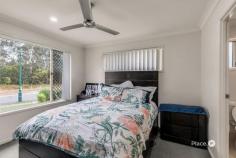  11 Okelly Ct Collingwood Park QLD 4301 Tucked away in a peaceful street with a leafy outlook, this four-bedroom home offers a relaxed lifestyle in a natural setting. The layout is both practical and welcoming, with a central living area that brings everyone together while still allowing space for quiet moments. Large windows partnered with tall cathedral-esque ceilings invite natural light throughout the home, enhancing the sense of space and comfort. All four bedrooms are carpeted and include built-in wardrobes, with the main bedroom featuring a private ensuite. The kitchen is positioned to overlook the main living area and is equipped with a dishwasher and ample bench space. Additional features include security screens on all windows and a fully fenced backyard, ideal for families or those who enjoy outdoor living. Key Features: - Four bedrooms with built-in wardrobes and carpet - Private ensuite to the main bedroom - Central living and dining area - Functional kitchen with dishwasher - Security screens throughout - Fully fenced backyard - Quiet street with leafy outlook - Close to schools such as Collingwood Park State school and Redbank Plains State High School, shops, and public transport Whether you're looking for a family-friendly home or a reliable investment, this property ticks all the boxes. Currently returning $565.00 per week with dependable tenants in place, it offers great value and peace of mind for investors. 