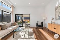  31 Mari Funaki Street Whitlam ACT 2611 Step into refined elegance, this architecturally designed home, perfectly positioned in the highly sought-after suburb of Whitlam. Positioned on an elevated block in the heart of Whitlam, This residence captures natural light throughout the day and offers a seamless blend of luxury, practicality, and comfort. Crafted to maximise natural light and space, the home features a striking open-plan living and dining area with soaring ceilings and expansive high-set windows. A separate formal lounge offers a quiet retreat. At the heart of the home, the designer kitchen is a true showpiece, boasting 40mm stone benchtops with waterfall edges, premium Bosch 900mm gas cooktop & appliances, and soft-close cabinetry-offering both practicality and contemporary style. Accommodation is generous, featuring a luxurious master suite with walk-in robe and sophisticated ensuite, a private guest bedroom with its own ensuite, and two additional bedrooms serviced by a designer bathroom and separate toilet. Outdoors, the alfresco entertaining area flows seamlessly from the family/dining area and easy care landscaped gardens designed for low-maintenance enjoyment. This premium home is enhanced by double-glazed windows, ducted reverse cycle heating and cooling, instantaneous hot water systems, and a 2000L water tank-delivering both comfort and energy efficiency. Located just moments from the Whitlam Community Playground, Molonglo River Reserve, and a short drive to Denman Village, Belconnen, and the Canberra CBD, this residence offers a perfect balance of lifestyle, location, and luxury. Property Highlights: Elevated block 419 m2 Single-level design with separate lounge room, family / Dining area Premium kitchen with 40mm stone, Bosch 900mm appliances & soft-close cabinetry Luxurious master suite with walk-in robe and large ensuite Guest suite with ensuite, plus two additional bedrooms with built-in robes Designer bathrooms Alfresco entertaining area & landscaped yard Ducted reverse cycle heating and cooling Double-glazed windows for energy efficiency instantaneous gas hot water systems 2000L water tank with pump High-quality finishes throughout Location Benefits: 2 mins walk to Whitlam Community Playground 5 mins walk to Molonglo River Reserve 8 mins drive to Denman Village Shops 11 mins drive to Westfield Belconnen 14 mins drive to Canberra CBD 