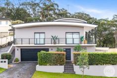  157 Bagnall Beach Road Corlette NSW 2315 Positioned in the highly sought-after suburb of Corlette, and approx. a 150m stroll from the beautiful water's edge of Bagnall Beach, this stylish and low-maintenance home offers the perfect blend of comfort, convenience, and coastal charm. Spread across two levels, the immaculate home features three bedrooms of accommodation, two bathrooms, and secure parking for two vehicles. On the entry level, you'll find two well-sized bedrooms, both with built-in wardrobes and split system air conditioning for year-round comfort. The main bathroom on this level is beautifully finished with floor-to-ceiling tiles in a modern white and grey palette, featuring a sleek vanity, shower, bath, and toilet. There's also a spacious laundry, which opens out to a private courtyard with low-maintenance landscaping. On the upper-level, natural light floods the generous living area through large windows and sliding doors that lead to a wrap-around balcony, perfect for entertaining or enjoying the sea breeze. The stunning kitchen is well-equipped with an electric cooktop, oven, dishwasher, white cabinetry, and stone benchtops, all complemented by a stylish blue feature tile splashback. The master bedroom is generously sized with built-in wardrobes, plush new grey carpet, and a private ensuite. It also enjoys direct access to the balcony through sliding doors, creating a seamless indoor-outdoor flow and the perfect spot to enjoy your morning coffee. This level also includes access to a second tiled courtyard, adding to the home's appeal and functionality for entertaining. With Dutchman's Beach, Anchorage Port Stephens, local cafes, schools, and shopping all nearby, this home presents an ideal opportunity for those seeking a relaxed beachside lifestyle or a fantastic investment in the heart of Port Stephens. 
