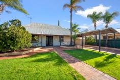  126 Varden Street PICCADILLY WA 6430 $649,000 You will love outdoor entertaining all year round at 126 Varden St! With a huge, enclosed patio, with bult in bar, outdoor toilet and established garden, this is the place to be! Situated close to North Kalgoorlie Primary School, and a short drive to Hannans Boulevard, location is ideal for young families and couples. Consisting of 4 good sized bedrooms, plus a 5th bedroom or study, 2 freshly renovated bathrooms, and a cosy living area with wood heating. The large kitchen has loads of storage, and a separate dining area. With lovely character features throughout, including lovely French doors from some bedrooms and dining area. The large 1012m2 block size as rear lane access to the 9x6m2 shed, with an additional storage shed for the gardening tools. A secure front fence and undercover parking at the front of the property, surrounding but lush lawns. • Large Family Home • 4 Bedrooms + Study/5th Bedroom • 2 Newly Renovated Bathrooms • 3 Toilets • Large, Spacious Kitchen with loads of storage • Cosy Living Area with Wood Heater • Enclosed Patio Entertaining Area • 9x6m2 Powered Shed • Garden Shed • Rear Lane Access • Carport at Front • Council Rates $2,218.19 (24/25) 