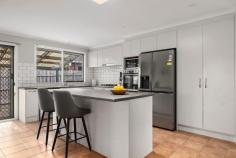  125 Franciscan Avenue Frankston VIC 3199 $950,000 - $1,045,000 Revamped to cater to the requirements of growing families, this spacious four-bedroom house guarantees comfort and privacy while envisioning a future full of possibilities. Set to the front of a sprawling 1,258sqm (approx.) block, it offers a large rear yard beyond a layout that's tailored to those who love to entertain. Positioned just a short walk from Kingsley Park Primary School and Round About Cafe, it welcomes families across two dedicated living zones, a central kitchen with modern appliances, and a covered rear deck that offers leafy aspects that fill further than the fence line. Watch the kids play securely in a yard that stretches across space ready for a swimming pool or a large extension (STCA), or landscape to include recreational delights such as a fire pit, large shed, or basketball key. Showcasing four inviting bedrooms and two light-filled bathrooms, including the spacious master with walk-in robe and ensuite, the space provides versatile accommodation options for families. Complete with high feature ceilings, a dedicated laundry, garden shed, and a double carport, the home presents an inspiring future full of possibilities just moments from Monash University, Frankston Hospital, Frankston Train Station and major arterial access. 