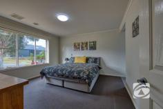  7 Balaton Dr Pakenham VIC 3810 $660,000 - $720,000 Immaculate Living in a Peaceful Pocket Tucked away in a quiet, family-friendly neighbourhood, this beautifully presented three-bedroom home with a separate study offers a perfect balance of space, style, and practicality. Designed for modern living, it features two generous living zones, a sleek kitchen with walk-in pantry and electric appliances, and a light-filled open-plan layout ideal for families and entertaining. All bedrooms are spacious with built-in robes, while the master enjoys a walk-in robe and private ensuite. The versatile study is perfect for working from home or use as a nursery. Outdoors, a large wrap-around pergola overlooks a lush, low-maintenance garden, providing the ideal space to relax or entertain. Additional highlights include a 6.6kW solar system, electric ducted heating and cooling, full-size laundry, and a double garage with rear roller access and space for extra vehicles. Immaculately maintained and move-in ready, this home delivers comfort, convenience, and quality in a peaceful, well-connected location. 