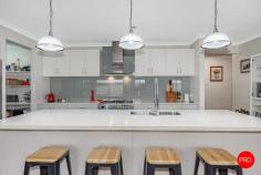  68 Warren Street Kyneton VIC 3444 • Four bedrooms plus office & three flexible living zones • Master retreat with ensuite & WIR; private kids' bedroom wing • Stylish kitchen with island, WIP & stainless appliances • Outdoor entertaining deck, tiered backyard & double garage 