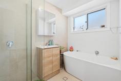  16 Balfour Cl Springfield NSW 2250 Fully renovated, flooded with natural light, and sitting pretty in Springfield—this three-bedroom beauty is the definition of move-in ready. Whether you’re buying your first home, upgrading from a shoebox, or just keen to ditch the reno headaches, this one’s ready to roll. The kitchen’s had a glow-up too—Bellini oven and stovetop, Smeg dishwasher, and a layout that makes sense. Float through hybrid timber-look floors, kick back in the sunny open-plan living, or soak the stress away in a bathroom that belongs in a boutique hotel (yep, we’re talking floor-to-ceiling tiles and a freestanding tub). Here’s the good stuff: – Three sunlit bedrooms, two with built-ins. – Bright, open kitchen with quality appliances. – Designer bathroom with floor-to-ceiling tiles and that tub. – Split system A/C, LED downlights, floating floors. – Private outdoor entertaining and a big, fenced backyard. – Oversized double garage with side access and space to spare, And the location? Walk to the bus stop, schools just around the corner, 10–15 mins to Gosford Station, and you’ll have your toes in the sand at Terrigal, Wamberal, or North Avoca in no time. 