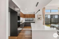  31 Mari Funaki Street Whitlam ACT 2611 Step into refined elegance, this architecturally designed home, perfectly positioned in the highly sought-after suburb of Whitlam. Positioned on an elevated block in the heart of Whitlam, This residence captures natural light throughout the day and offers a seamless blend of luxury, practicality, and comfort. Crafted to maximise natural light and space, the home features a striking open-plan living and dining area with soaring ceilings and expansive high-set windows. A separate formal lounge offers a quiet retreat. At the heart of the home, the designer kitchen is a true showpiece, boasting 40mm stone benchtops with waterfall edges, premium Bosch 900mm gas cooktop & appliances, and soft-close cabinetry-offering both practicality and contemporary style. Accommodation is generous, featuring a luxurious master suite with walk-in robe and sophisticated ensuite, a private guest bedroom with its own ensuite, and two additional bedrooms serviced by a designer bathroom and separate toilet. Outdoors, the alfresco entertaining area flows seamlessly from the family/dining area and easy care landscaped gardens designed for low-maintenance enjoyment. This premium home is enhanced by double-glazed windows, ducted reverse cycle heating and cooling, instantaneous hot water systems, and a 2000L water tank-delivering both comfort and energy efficiency. Located just moments from the Whitlam Community Playground, Molonglo River Reserve, and a short drive to Denman Village, Belconnen, and the Canberra CBD, this residence offers a perfect balance of lifestyle, location, and luxury. Property Highlights: Elevated block 419 m2 Single-level design with separate lounge room, family / Dining area Premium kitchen with 40mm stone, Bosch 900mm appliances & soft-close cabinetry Luxurious master suite with walk-in robe and large ensuite Guest suite with ensuite, plus two additional bedrooms with built-in robes Designer bathrooms Alfresco entertaining area & landscaped yard Ducted reverse cycle heating and cooling Double-glazed windows for energy efficiency instantaneous gas hot water systems 2000L water tank with pump High-quality finishes throughout Location Benefits: 2 mins walk to Whitlam Community Playground 5 mins walk to Molonglo River Reserve 8 mins drive to Denman Village Shops 11 mins drive to Westfield Belconnen 14 mins drive to Canberra CBD 