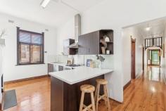  6 Waterhouse Rd South Plympton SA 5038 $875,000 to $910,000 From its classic façade complete with picket fence to gorgeous upgrades throughout, this 1925-built Bungalow maisonette is character meets contemporary in the very best way. Polished timber floorboards, original fretwork and sky-high ceilings line the entry, where both bedrooms are easily accessible, the master offering mirrored robes and a northerly-aspect outlook via big windows to the front yard. Upgraded with full-height tiling, shower over bath and pedestal vanity, the bathroom is just down the hall, with convenient separate toilet. Centrally positioned, a cosy formal lounge room enjoys a ceiling fan, split system air conditioner and ornamental open fireplace with mantle. Open, airy and renovated, the modern kitchen and meals space will delight cooks of the home with a gas cooktop, glass splashback, dishwasher, twin-door pantry, plenty of storage and a breakfast bar. Colonial-style French doors open onto a brilliant rear alfresco space, where a curved roof pergola with ceiling fan adds protection while still allowing natural light, and the outdoor kitchen with gas connection is ready for making year-round entertaining a piece of cake, all with the established and easy-care rear garden as your backdrop. More you'll adore: - Separate renovated laundry - Timber venetian blinds - Ceiling fan + ornamental fireplace to bedroom 2 - Remote lockable carport + off-street parking with drive-through access to rear garage - Raised garden beds with westerly aspect along driveway - Ducted evaporative cooling + gas heating - Close proximity to Emmaus Christian College You'll love the location, where local shops, cafes and hotels, bus and train transport, The Crescent Reserve and Edwardstown Oval are all within walking distance, and Castle Plaza Shopping Centre is just a few minutes' drive. Close to CBD and the sea and presented to perfection, this one will have a high appeal; come and check it out for yourself. 