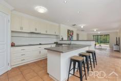 1/477 Wee Jasper Road Tumut NSW 2720 Offered to the market for the first time since the original build almost twenty years ago and set amongst the picturesque Tumut River Orchard Estate, sits this meticulously designed and beautifully presented four-bedroom, free flowing family home. Comprising of approximately 248m2 of internal living, with entertainment, separation of living and lifestyle at the heart of the design, you will love the space afforded in this light filled low-set family home that takes advantage of its stunning and expansive surrounds. Do not miss your opportunity to secure this immaculately presented and maintained family home, in the picturesque surrounds of the Tumut River Orchard Estate, call today to book your inspection. Premiere Features: - Four king sized bedrooms, all with built in robes and ceiling fans, the master boasting walk in robe and adjoining ensuite - Light filled main bathroom with floor to ceiling tiling, separate shower and bath and large single vanity - Centrally located kitchen acting as the hub of the home with electric cooktop, dishwasher and ample storage options, all overlooking the main internal living options and direct access to the large alfresco entertaining area - Open plan family area with built in and illuminated display niche's - Large formal rumpus area to one end of the plan with gas bayonet heating option and split system air conditioning - Formal tiled dining area - Additional third living area with gas heating option and positioned perfectly as a parent's retreat with the ability to close off the Northern wing of the home - Large formal entry - Separate toilet - Triple linen cupboard - Large internal laundry with direct external access, boasting built in cabinetry and clothes hamper - Centrally located and large outdoor alfresco entertaining overlooking the manicured grounds - Rear covered entertaining area - Double lock-up garage with direct internal access - Double bay shedding with ample light and power and additional double bay carport - Low maintenance and manicured established grounds, with vehicle access to the entire house allotment - Garden shedding, dog run and enclosed vegetable garden area - Bio-cycle septic system - 45,460 litre in-ground rainwater tank (house and grounds), easily converted between rainwater and river water - Reticulation system through front yard - Built in animal containment system - Approximate 4.16-acre allotment (house grounds approximately over 7,100m2) - Ducted evaporative air conditioning, gas heating options and reverse cycle split system air conditioning - On site estate "clubhouse" common use area boasting tennis court, inground pool and large clubhouse (Approximately $1,500 per annum owner contribution) - Direct access to walking, cycling, swimming and fishing along the banks of the Tumut River 