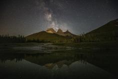 Experience the wonder of the night sky with this breathtaking “ Three Sisters Milky Way ” fine art print by Andy Denton. Captured in Alberta’s Canadian Rockies, this stunning nightscape blends the iconic Three Sisters mountain peaks with a glowing Milky Way sky. A perfect centerpiece for your home, office, or gallery wall.
