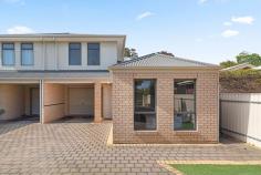  63B Argyle Ave Marleston SA 5033 Clean-lined and contemporary with a convenient ground floor master bedroom suite, this 2009-built townhome comes perfectly presented. Lined with large format tiles, a front entry offers instant access to a comfortable master bedroom, where plush carpet, built-in robes and an ensuite bathroom with corner shower add a touch of luxury to the every day. With internal access from the garage, a light kitchen, living and dining space enjoys sliding doors onto an easy-care rear courtyard with pergola and café blinds. Equipped with plenty of storage space, gas cooktop, dishwasher, breakfast bar and updated benchtops and sink, the kitchen will please the likes of any home cook. Upstairs, a further two carpeted bedrooms are serviced by a central main bathroom with inset bath, corner shower and handy extra storage area. More you'll adore: - Ducted reverse cycle air conditioning - Built-in robes to bedroom 2 - Upstairs linen storage + study nook - Separate laundry with storage + outside access - Secure single garage with drive-through access + covered driveway With Rex Jones and Weigall Oval Reserves at your fingertips, you'll also find easy access to Kurralta Park Shopping Centre, transport and local schools from this wonderfully central position to CBD and sea. A worry-free investment or low maintenance live-in in a top spot. 