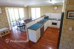  34 Westmacott Street Castletown WA 6450 Positioned just one street back from Castletown Quays, this solid double brick 3-bedroom home is ideal as an investment or starter property. The open plan layout features a functional kitchen, formal lounge, and timber look vinyl flooring throughout. Comfort is assured with ceiling fans in the living area & main bedroom and a tile fire for heating. Outside offers a carport under the main roof, a garden shed, 2 x established raised garden beds, auto reticulation, rainwater tank and an extensively paved driveway for low-maintenance living. 
