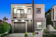  4A Paine Avenue Moorebank NSW 2170 This stunning custom-built residence showcases modern elegance, luxury finishes, and thoughtful design throughout. Perfectly combining comfort and sophistication, this home offers a lifestyle that is second to none. Property Features: Four generous bedrooms - Master with walk-in robe, ensuite featuring a double-head shower, and private balcony Convenient laundry chute in the main bedroom Custom joinery throughout, showcasing superior craftsmanship Separate media room, ideal for family movie nights or a private retreat Stylish kitchen with premium appliances, stone benchtops, and ample storage Elegant gas fireplace creates a warm and inviting atmosphere 26-panel solar power system for energy efficiency In-ground saltwater swimming pool Outdoor kitchen with built-in BBQ and bar fridge Half-court Basketball court and low-maintenance landscaped yard - perfect for family fun Security Camera & Alarm system This architecturally designed home is ideal for growing families who love entertaining in style. Located in one of Moorebank's most sought-after streets, this property is close to quality schools, shops, and transport. Features: Close To Schools Close To Shops Close To Transport 