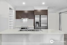  19 Daybreak Street Yarrabilba QLD 4207 $750,000 - $800,000 Lifestyle Location Near Park, Shops and Cafes, Combining Everyday Convenience with a Flexible Design Perfect for Relaxed and Enjoyable Family Living. A beautifully appointed kitchen sits at the heart of the home, complete with a gas cooktop, generous walk-in pantry, and ample bench space for both meal preparation and casual dining. Positioned to overlook the air-conditioned open plan living and dining area, it creates a natural gathering point for family meals, weekend entertaining, or simply enjoying a morning coffee while staying connected to the rest of the household. Separate living room offers a versatile space that can be tailored to suit your lifestyle. Whether set up as a media lounge for family movie nights, a quiet retreat for reading, or a children’s playroom, its position away from the main living zone ensures peace and privacy. Positioned at the rear of the property, the master suite serves as a tranquil escape. A spacious walk-in robe provides excellent storage, while the ensuite features double vanities for convenience and a touch of luxury. Comfort is assured year-round with both air conditioning and a ceiling fan, making it the perfect place to unwind at the end of the day. Additional bedrooms each include built-in robes and ceiling fans, creating practical, comfortable spaces for family members or guests. These rooms can also adapt for use as a home office or hobby room, offering flexibility for changing needs. Well-designed and thoughtfully appointed, the main bathroom caters to busy households with a separate shower, relaxing bathtub, and an independent toilet, ensuring functionality and ease during the morning rush. An internal laundry with direct outdoor access makes household tasks simple and efficient, providing plenty of space for storage and organization. Undercover alfresco space extends the living area into the outdoors, creating the perfect setting for weekend barbecues or peaceful evening unwinding. A fully fenced yard enhances safety for children and pets while providing a private and inviting backdrop for gatherings. Property Features: •Built in 2016, offering a modern layout suited to comfortable family living. •Kitchen appointed with a gas cooktop, walk-in pantry, and ample bench space for meal preparation and casual dining. •Open plan living and dining area fitted with an air conditioner, providing a central hub for everyday gatherings and entertaining. •Separate living room ideal for use as a media space, quiet retreat, or children’s playroom. •Master bedroom positioned for privacy, complete with a walk-in robe and ensuite featuring double vanities. •Additional bedrooms each include built-in robes and ceiling fans for comfort and convenience. •Main bathroom designed with a shower, bathtub, and separate toilet to suit the needs of busy households. •Internal laundry with direct outdoor access for practical household management. •Undercover alfresco creating a sheltered space for outdoor dining and relaxation. 