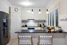  11 Crozet Court Burleigh Waters QLD 4220 $2,450,000 Set in one of Burleigh Waters' most exclusive cul-de-sacs, this stunning 940m² north-west facing residence commands an impressive 40 metres of serene water frontage, elevated over the breathtaking expanse of Pelican Lake. A true lifestyle estate, this masterfully designed home blends timeless sophistication with relaxed, resort-style living in the Gold Coast's most coveted enclave — Burleigh Cove. From the moment you enter, you're greeted with sweeping water views from all key living zones. Including the kitchen, dining, living, and the luxuriously appointed master suite. Indoor-outdoor flow is seamless, with multiple covered alfresco spaces tailored for entertaining and private retreats alike. A hardwood-decked gazebo sits gracefully beside the sparkling pool with frameless glass fencing, the perfect vantage point for golden sunsets over the lake. All this, just moments from patrolled Burleigh Beach, James Street's vibrant dining and shopping scene, local markets, elite schools, Bond University, and only 20 minutes to Gold Coast International Airport. Property Features: * Elevated 3.5m entry * 2.6m High ceilings throughout * Four generously sized bedrooms with built-in robes * Private master retreat with expansive lake views, walk-in robe, and spa ensuite * Family-sized kitchen with 900mm induction cooktop, large pantry & Stone Tops * Multiple alfresco entertaining zones + hardwood decked gazebo * Sublime resort-style pool & frameless glass fencing * Private pontoon and fully fenced yard on a wide 40m waterfront * Ducted air conditioning, ceiling fans, and underground gas lines * Spacious laundry with ample storage * 18 Solar panels 6.4K with battery storage * Double lock-up garage with workspace * Freshly painted exterior * Vacuum made * 250 Litres new Rheem hot water tank Burleigh Cove is evolving as one of the Gold Coast's most distinguished estates. 'Burleigh Cove' was created in 1998 with homes set to a very high standard and complimented with gorgeous, landscaped settings, parks and featuring splendid waterways with ocean fed Burleigh Lake. Located in a convenient central location, just a moments' walk to nearby parks, gorgeous Burleigh Lake & Stocklands Shopping Centre. On the afternoons that aren't spent in your backyard entertaining with family & friends, head up to the beloved 'James St' cosmopolitan and famous Burleigh Heads beach across the nearby footbridge. The buzzing heart of Burleigh is walking distance, just moments from your doorstep. The proximity to the famous Burleigh Beaches, renowned schools, "James Street" shopping precinct, boutique cafes, world class restaurants, bars and popular surf clubs is what gives this property the priceless sought-after lifestyle, presenting the Burleigh dream. This property is not just a house; it's a masterpiece waiting to be called home. Don't miss the opportunity to make this dream residence yours. 