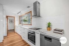 37 Begonia Street Lindisfarne TAS 7015 $640,000 - $680,000 Classic 1971 brick beauty with sweeping bird's-eye views of Mt Wellington, this home offers an inviting and practical layout ideal for a range of buyers. The open plan living area feels bright and welcoming, with a refreshed kitchen at its heart - perfect for everyday living and easy entertaining. From the lounge, step out to the private courtyard, a great spot for relaxed BBQs or afternoon catch-ups with friends. There are three comfortable bedrooms, along with a family-friendly bathroom featuring both a shower and a separate bath. Car storage is well catered for with a double garage featuring an automatic roller door, plus extra off-street parking for a second vehicle. At the top of the block, you'll find a bonus yard space with a chook pen and clothesline - ideal for those wanting a touch of self-sufficiency. Set on a 668sqm (approx.) block with a building size of 98sqm (approx.) plus a 36sqm (approx.) garage, this property is a fantastic opportunity for first home buyers or a builder keen to extend (STCA). 