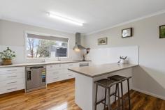  5 Simpson Court Saddleworth SA 5413 Welcome to 5 Simpson Court, Saddleworth - a well-designed and modern 3-bedroom home set on a spacious 901m² block, offering comfort, functionality, and plenty of room to move. Built in 2016 and positioned in a quiet court location, this property is ideal for first homebuyers, families, investors, or downsizers seeking space and convenience. From the moment you step through the front door, you're greeted by the light-filled dining room with sliding glass doors that open to a decked stairwell leading down to the beautiful cottage-style gardens and generous shedding. The heart of the home is the kitchen, featuring a four-burner electric stove, electric oven, stainless steel tapware, and a dishwasher. A large walk-in pantry provides an abundance of bench and cupboard space, while a well-placed window overlooks the established garden, drawing in loads of natural light. At the home's centre is a comfortable lounge room, fitted with a split system and striking barn-style feature doors that open to an elevated patio with a shade sail - the perfect spot to relax or entertain. The master bedroom offers a peaceful retreat, complete with his and her walk-in robes, carpeted floors, a ceiling fan, and a private ensuite with shower, toilet, and single vanity. Bedrooms two and three are also carpeted and generously sized, ideal for children, guests, or a home office. The main bathroom and laundry are combined in a smart, space-saving design and offer a shower, toilet, single vanity, and excellent storage options. The home is fitted with ducted evaporative air conditioning throughout, a heat pump hot water system, and solar panels to help keep energy costs down. A single carport with an automatic roller door includes extra space for a trailer, with an additional external access point leading inside past the linen press for added convenience. Out the back, you'll find excellent shedding including a high-clearance undercover area approximately three metres in height - perfect for caravans, boats, or workshop needs. A second storage shed adds even more functionality, while a 5000-litre rainwater tank supports the garden and adds to the home's efficiency. Located in a quiet and family-friendly part of Saddleworth, 5 Simpson Court offers relaxed country living with all the modern features you could need. It's the kind of property you'll feel right at home in. 