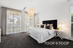  95 Church Terrace Walkerville SA 5081 Introducing a sensational custom designed sanctuary that ticks every box. With a highly prized position on the whisper quiet end of one of Walkerville’s most exclusive terraces, it boasts a sophisticated interior of effortless contemporary style that links indoor and outdoor spaces together with a north facing rear, manicured plantings and a sensational pool. With nothing left to do but move in, this is a truly exceptional chance to immerse yourself in one of Adelaide’s most prestigious and desirable city fringe locations ENTRANCE AND FORMAL LIVING Custom built to a high standard and completed in 2018, the house is gently elevated above the treelined street. A front lawn edged by clipped Japanese box and Crepe Myrtles frame the refined contemporary façade that incorporates a series of pillars punctuated by full length windows, a porch with a soaring timber door, and a remote entry double garage. Inside, superb timber floors stretch past a chic formal living space towards sundrenched open plan living. PRIMARY BEDROOM SUITE Privately situated, the generously proportioned primary suite has a dress circle position overlooking the front lawn through picture windows adorned with sheers and curtains. In addition to a walk-in robe, the stylish ensuite includes a separate WC and shower, double vanities, heated towel rails, and introduces striking black and white Moroccan style tiles that are mirrored in the laundry and main bathroom suite. FAMILY ACCOMMODATION A private wing includes two bedrooms both with built-in robes, and a third bedroom with built-in workspace that could be used as a study if desired. All share a 3-way bathroom suite with a separate WC and vanity. OPEN PLAN LIVING Drenched in north facing sunshine and warmed by an instant gas fire, open plan living is large and comfortable with zoned lounge, meals and kitchen overlooking the glorious rear grounds and pool. The kitchen is the star, with a host of integrated European appliances and a central island bench around which to gather and entertain friends. A large walk-in pantry provides oodles of storage and prep space. ALFRESCO LIVING AND POOL Linked to open plan living through sliders, alfresco living is something very special. Bathed in sunshine, undercover dining sits beside the pool and is equipped with an outdoor kitchen with Beefeater BBQ, gas wok ring, bar fridge and built in joinery. Soak up the sun beside the stunning heated pool with wide shallow steps on which to perch and enjoy the peaceful surrounds that comprise terraced lawns edged by Murraya and ornamental pears. FEATURES TO LOVE POOL • Solar heated • Salt filtration • Fully tiled & glass fenced • Sun lounge area PARKING • Remote gate entry • Double remote entry garage with secure internal access • Driveway with additional parking space APPLIANCES • De Dietrich oven & induction cooktop • Ilve oven • Dishwasher • Integrated Fridge/Freezer • Outdoor bar fridge • Beefeater BBQ & gas ring TECHNOLOGY & COMFORT • Instant Heat & Glo gas fire • R/C Air conditioning • Heated towel rail in primary suite • Quality window treatments • Pedestrian gate intercom • Remote entry sliding gate GARDEN • Automatic irrigation • Terraced lawns, hedging and ornamental trees LOCATION: Exclusive city-fringe less than 8km from Victoria Square SCHOOLS: Coveted zoning to Adelaide Botanic & Adelaide High Schools; Walkerville Primary School. Walk to Wilderness School & St Andrews. Close to PAC & St Peters College SHOPPING: Walkerville Terrace, Melbourne Street & O’Connell Street boutique shopping & cafes RECREATION: Walk to Walkerville Oval, Memorial Gardens & Bowling Club. Close to Linear Park & parklands 