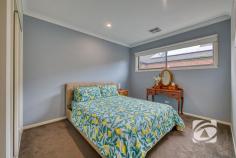  21 Illawarra Way Pakenham VIC 3810 $795,000 - $870,000 Your Family’s Next Chapter Starts Here Showcasing impressive street appeal with beautifully landscaped gardens, this exceptional family home offers quality, comfort, and space rarely found. A true opportunity for families seeking a premium lifestyle. The home features four well-appointed bedrooms, including a spacious master suite with a walk-in robe and oversized ensuite. The remaining bedrooms are thoughtfully positioned throughout the home and are serviced by a central bathroom and separate toilet. Multiple living zones provide flexibility for the whole family, with three separate areas to relax, entertain, or retreat. The heart of the home is the expansive open-plan living and dining area, bathed in natural light from large windows that frame views of the surrounding greenery. The gourmet kitchen will impress any home chef, complete with a 900mm oven, dishwasher, generous storage, walk-in pantry, and a large breakfast bar. For quiet nights in, enjoy the dedicated theatre room, while the third living space offers versatility to suit your needs. A separate study adds practicality for remote work or study. Step outside to a stunning tiered timber deck, creating a seamless indoor-outdoor flow—ideal for entertaining or simply unwinding in peaceful surrounds. Additional highlights include refrigerated ducted heating and cooling, a 10kW solar system, hardwired security camera system, large laundry, and double car accommodation. 