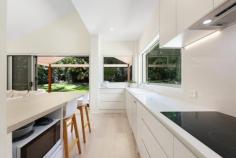  15 Joanne Court Currumbin Valley QLD 4223 $2,495,000 Immersed in tranquility, this architect-designed, fully renovated sanctuary promises an enviable lifestyle. Nestled in a natural wonderland, it's a private 1.5 acre paradise bordering bushland, where peace and connection to nature are part of everyday living. A gentle summer creek meanders through the grounds, enhancing the serene atmosphere and offering a picturesque place to pause and reflect. Crafted to deliver modern comfort and charm, expansive glazing throughout frames uninterrupted views of the lush greenery while also inviting in abundant sunshine. Soaring pitched ceilings further accentuate the sense of light and space, culminating in an ambience that is as crisp and fresh as it is warm and welcoming. The open plan kitchen, living and dining zone emulates this, acting as the beating heart of the home. Whether cooking, relaxing or sharing a meal, it's a hub where everyone wants to linger. Impressively, it's also primed for entertaining. Beyond the large slider doors an expansive alfresco deck beckons, ideal for hosting guests or savouring the stillness of nature. A second sunlit living space offers flexibility for growing families, complemented by four bedrooms. Led by an oversized master suite with a walk-in robe and ensuite, pamper yourself at the end of each day with a soak in the freestanding bath. A second bedroom also features a walk-in robe, two additional bedrooms include built-ins and all three are accommodated by a sophisticated main bathroom with a separate toilet. Outside, the home continues to delight. Boasting an enchanting landscape of open lawns, towering shade trees, and established gardens, they teem with birdlife, wallabies, and wildlife. Plus, take advantage of a magnesium pool to beat the summer seat and a paved sun patio to catch some rays. Tucked away near the end of a peaceful cul-de-sac, you won't have to compromise on proximity to essential amenities. Quality public and private schools are within approx. 8 minutes, and you can swap the green for the gold too, with the sand and surf of Palm Beach Currumbin Beach and Burleigh under 15 minutes by car. Shops, sports grounds, cafes, and parks are close too, along with accessing the M1. House Features: Fully renovated, architect designed two-storey home infused with modern comfort, calm and charm Fresh, light and bright interiors enhanced by high pitched ceilings Expansive glazing throughout to enjoy views of the lush greenery Contemporary kitchen with a walk-in pantry, breakfast bar, plumbing for fridge and quality appliances Open plan living and dining zone enhanced by a soaring raked ceiling and a seamless connection to the alfresco deck Second sunlit living space Oversized master suite tucked away upstairs, features a walk-in robe and luxe ensuite with a freestanding bath Three extra bedrooms; one with a walk-in robe and two with built-in robes Sophisticated main bathroom with separate toilet Expansive alfresco entertaining deck Private magnesium pool with paved sun patio Enchanting and private garden paradise, with open lawns, established gardens and towering shade trees Double car garage Ducted air-conditioning upstairs, split systems downstairs 2 Attic storage areas with ladder access Property Features: 1.5 acre estate backing onto verdant bushland Natural wonderland thriving with birdlife, wallabies and wildlife A gentle summer creek meanders through the grounds, enhancing the serenity of the setting Location: Approx. 5 mins to Tallebudgera State School and shops Approx. 6 mins to St. Augustine's Parish Primary School Approx. 8 mins to St. Andrew's Lutheran College Approx. 12 mins to Palm Beach Approx. 12 mins to Currumbin Beach Approx. 14 mins to Burleigh Heads Approx. 18 mins to Gold Coast Airport Approx. 34 mins to Surfers Paradise 