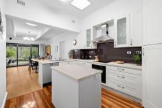 4 Moldavia St Glandore SA 5037 $1,475,000 to $1,575,000 Its timeless façade garnering instant street appeal, this stone fronted stunner on 700 m2 (approx.) is a family favourite, born entertainer and forever home rolled into one. Lined with polished original timber floors, a wide formal entry with sky high ornate ceilings offers views straight through to the backyard. Easily accessible from the entry, a front positioned master suite is equipped with full-height robes and a two-way ensuite bathroom with corner shower, with a further three bedrooms offering priceless flexibility, including an equally roomy bedroom two with gas heater overlooking the front porch. An intimate formal lounge room with open fireplace with full-height shelves and bifold doors onto the addition will transform into the cosiest of libraries during the cooler months. With functionality at the forefront, a gorgeous skylit kitchen offers crisp white shaker-style cabinetry, an island bench, corner pantry, dishwasher, chic chocolate glass splash back and breakfast bar to home cooks, along with a lovely view of the substantial living and dining room rear extension with beamed ceilings. Sliding doors from here open onto the stunning paved alfresco, where a huge gabled roof pergola perfectly frames a postcard-worthy garden backdrop decades in the growing. A towering weeping willow as the focal point, family gatherings will naturally revolve around its cascading curtain of leaves certain to spark the imaginations of the young – and young at heart – while an established Fig tree offers enchantment of its own. Complete with manicured lawns, paved areas, a cubby house and flourishing garden borders, this backyard is in a league of its own. A contemporary bathroom with frameless shower, back-to-wall bath and full-height tiling has been well-designed to incorporate a sophisticated laundry setup with excellent storage and hanging space. We also love: - Ducted reverse cycle air conditioning - Solar panels - Carport + garage with workshop + garden shed - Superb outdoor entertaining space with wraparound pergola & ceiling fan - Linen storage - Built-in robes to bedroom 3 - Manicured front gardens. Just a few hundred metres from the Glandore Oval, Marie Gregan Playground, bus and Emerson Railway Station, you'll find the tram and Black Forest Primary School within easy reach in this fabulous location zoned for Adelaide High and Botanic High School. Beautifully executed with nothing left to do. Be warned, you're going to fall for this one. 
