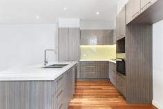  4/1311 Toorak Road Camberwell VIC 3124 $868,000 Nestled at the rear of a striking architectural development, this thoughtfully designed, low-maintenance three-bedroom town residence is bathed in natural light. Enhanced by double glazing for a 6-star energy rating and a peaceful ambiance, it offers a picturesque garden view with seamless access to an inviting outdoor courtyard through sliding patio doors. The open-plan living area features a designer kitchen with stone benchtops and premium Miele appliances, complemented by a convenient downstairs powder room. Upstairs, the generously sized bedrooms, including a master with ensuite, are fitted with built-in robes and are serviced by a stylish central bathroom. Additional highlights include video intercom, secure entry, polished timber floors, ducted heating and cooling, and a spacious double garage with remote control access. Located for ultimate convenience, this property is surrounded by transport options, shops, restaurants, a supermarket, and a medical center, all within walking distance. It is also close to parks, public and private schools, including Hartwell Primary, Wattle Park Primary, Deakin University, and Presbyterian Ladies College, just a short tram ride away. This exceptional residence is perfect for professional couples, investors, and downsizers seeking a low-maintenance lifestyle with access to premium amenities. 