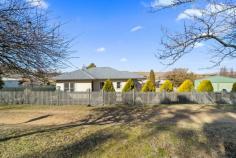  10 Smith Street Cooma NSW 2630 $520,000 This must-see 3-bedroom family home is in the perfect location to soak up the best country lifestyle Cooma has to offer. Just a short stroll to the town centre, this cosy home offers a one-minute drive to Woolworths and ALDI, and is 2km from Cooma Hospital and Cooma Showground. Featuring energy efficient wood-fired heating for atmosphere and warmth on chilly days, air overflow can be pumped into the front entrance way at the flick of a switch. Alternatively, the Brivis gas ducted heating and cooling system allows the homeowner to maintain the perfect temperature year-round. A wireless Bosch 3000 alarm system with CCTV and infra-red function provides further peace of mind. The home has a splash of fresh paint with neutral grey and crisp white trim, and new easy-care wool blend carpets, this well-cared-for and immaculate house offers a blank canvas for the new owner to make this home their very own. Easy to use and maintain, the newly renovated kitchen features an electric oven plus the convenience of a dishwasher for those who love to entertain or have a growing family. Accessed via the self-contained laundry is a small porch and large paved area, ideal for a pop-up gazebo or more permanent entertaining structure. A delight for gardening enthusiasts, the generous garden beds have been mulched for decades and the soil is rich for planting. This fully fenced and secure property also features spacious lawns, offering a huge play area for children and adults alike. Completing this property is a huge (6.86m X 7.86m) double garage, with power already installed as well as plumbing for amenities. (Council pre-approved for a kitchenette, washing machine, toilet, laundry and shower facilities to be installed). Under the current owner for more than 20 years, this 858m 2 property is a rare find that offers loads of potential for personalisation, enhancement and development. 