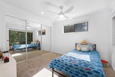  18 Tuesday Drive Tallebudgera Valley QLD 4228 Set on almost 3 acres of private bushland this secluded property offers an exceptional lifestyle for families seeking space and serenity without compromising on convenience. Designed to embrace the natural slope of the land, the home unfolds across a series of levels where thoughtful modern upgrades enhance internal structural features of raked ceilings and internal exposed brick. An inviting saltwater pool, huge timber deck and large multipurpose studio combine for the perfect venue for large scale celebration and adds a layer of versatility to this property. All of this situated within an idyllic hinterland setting just minutes from schools, shops and Burleigh's vibrant coastal lifestyle. A sophisticated kitchen with gas cooking and double ovens is set to impress and the central island with breakfast bar will invite company and conversation for the chef. Join the family in the adjacent dining area, move to the deck for alfresco meals with friends or gather in the sunlit living room where a fireplace promises a cosy ambience on those cooler nights. Three bedrooms feature on the floorplan across the upper levels. Two bedrooms, each with ceiling fans and built-in robes share the main bathroom with double basin vanity and dual head shower over bath. The top level of the home is given over to the master suite, a welcome sanctuary with both walk-in robe and ensuite. Outdoors you'll discover the poolside entertainment zone that will be the envy of your friends - a fabulous hub to relax and recharge or host memorable special occasions. The studio with kitchenette and powder room also offers further flexibility – ideal for a home office or private guest retreat. Additionally, a third full bathroom and built-in storage can be found in the double garage while a large shed with adjoining carport/woodshed provides further practical infrastructure. This location promises a tranquil valley feel without sacrificing access to essential amenities. Tallebudgera State School, St. Andrews Lutheran College and local shopping are all reached within a 7 minute drive and only 10 minutes away is Burleigh Heads with renowned beaches and a vast array of dining options. Currumbin Beach, Kingscliff and Surfers Paradise are also easily accessible within a half hour drive. House Features • Modern kitchen custom cabinetry with 5-burner gas cooktop, double oven & island bench • Lounge room with fireplace and raked ceiling • Dining area with air-conditioning and built-in cabinetry • Expansive poolside studio/multipurpose room with kitchenette and powder room • Top floor master suite with walk-in robe, ensuite and air-conditioning • Two additional bedrooms with built-ins and ceiling fans • Family bathroom with double vanity and dual shower heads • Laundry with linen cupboard and external access • Double garage with internal access, built-in storage and bathroom • Multiple outdoor living and entertaining zones • Saltwater pool with surrounding timber deck and outdoor shower • Secluded property on 11615m2 in private Tallebudgera Valley setting • Double bay shed with adjoining carport/woodshed • Shade sail parking Location • 7 mins approx. to Tallebudgera State School, St. Andrews Lutheran College • 7 mins approx. to local shopping • 10 mins approx. to Burleigh Heads • 16 mins approx. to Currumbin Beach • 19 mins approx. Gold Coast Airport • 24 mins approx. to Kingscliff Beach • 30 mins approx. to Surfers Paradise 