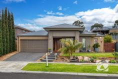  21 Illawarra Way Pakenham VIC 3810 $795,000 - $870,000 Your Family’s Next Chapter Starts Here Showcasing impressive street appeal with beautifully landscaped gardens, this exceptional family home offers quality, comfort, and space rarely found. A true opportunity for families seeking a premium lifestyle. The home features four well-appointed bedrooms, including a spacious master suite with a walk-in robe and oversized ensuite. The remaining bedrooms are thoughtfully positioned throughout the home and are serviced by a central bathroom and separate toilet. Multiple living zones provide flexibility for the whole family, with three separate areas to relax, entertain, or retreat. The heart of the home is the expansive open-plan living and dining area, bathed in natural light from large windows that frame views of the surrounding greenery. The gourmet kitchen will impress any home chef, complete with a 900mm oven, dishwasher, generous storage, walk-in pantry, and a large breakfast bar. For quiet nights in, enjoy the dedicated theatre room, while the third living space offers versatility to suit your needs. A separate study adds practicality for remote work or study. Step outside to a stunning tiered timber deck, creating a seamless indoor-outdoor flow—ideal for entertaining or simply unwinding in peaceful surrounds. Additional highlights include refrigerated ducted heating and cooling, a 10kW solar system, hardwired security camera system, large laundry, and double car accommodation. 