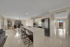  20 Canal Street Calliope QLD 4680 $629,000 20 Canal Street incorporates the epitome of individual space for each family member. This is the ideal home for the extended family or those who having regular visitors. Offering four spacious bedrooms, three with their own ensuite and the family bathroom. Massive, centralised family living and dining space, PLUS media room at the front of the home. Close to 250m2 of living under roof in the popular Cloudscape Estate. Perched on the high side of the road capturing breezes and views. There is access to the right of the home. Ideal for storing the trailer of small boat. Double gate access in the rear fence to the vacant land behind the home… BONUS! The zoned ducted air-conditioning is ideal for year round comfort. The family friendly floorplan will not disappoint. The over-sized master bedroom is located at rear of the home, complete with walk-in-robe. The kitchen is the hub of the home overlooking the tiled living space with vision through to the backyard. Ideal for watching the kids while preparing the family meal. Tick, tick, and tick..! Spacious four bedroom home with four bathrooms on elevated block Large floorplan to accommodate extended families Central galley style kitchen with all the modcons Separate media room at the front of the home Over-sized master bedroom situated away from the other bedrooms Three ensuites, plus family bathroom with separate toilet Double automatic garage with internal access Internal laundry Solar panels - save on your power bills Fenced 640m2 (approx.) block with access to vacant land behind - large garden shed for storage Close to Calliope IGA Shopping Centre plus both primary and high schools 