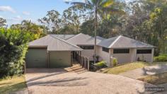  6 Platypus Ct Lawnton QLD 4501 $989,000 Set in a whisper-quiet cul-de-sac and perched on an elevated 1,166m² block, this architecturally designed masterpiece is a stunning fusion of contemporary style and natural serenity. Boasting sweeping panoramic views from its expansive entertainer’s deck, this home offers a unique treetop lifestyle just minutes from all conveniences. Step inside and be immediately captivated by the home’s seamless indoor-outdoor flow, polished hardwood floors, and open-plan living zones that take full advantage of the incredible outlook. Key Features & benefits: Private Parents’ Retreat: Spacious master suite featuring a walk-in robe and stylish ensuite Children’s Wing: Two generous bedrooms with built-ins and ceiling fans, plus dedicated study area, family bathroom & separate toilet Entertainer’s Dream: Huge covered deck with privacy blinds overlooking tropical landscaping and a sparkling inground pool with Himalayan sandstone paving Gourmet Kitchen: Galley-style with ample bench space and storage Expansive Living: Light-filled, air-conditioned open plan living/dining area with polished hardwood floors Lower-Level Potential: Massive covered utility space perfect for play areas, rumpus room, future dual living or home business Resort-Style Pool Area: Landscaped and private, perfect for cooling off & enjoying summer gatherings Double Remote Garage + Lock-up workshop and additional storage All of this is set on a landscaped 1,166m² block with plenty of room to grow or expand. Whether you’re entertaining friends, relaxing on the deck, or taking a dip with the kids, this unique home delivers a tranquil lifestyle escape just minutes away from everything a busy family might need including bus and rail, multiple child care centres & schools, shopping centres, plus much more. Vacant, staged and move-in ready – this is your chance to secure a one-of-a-kind family haven. 
